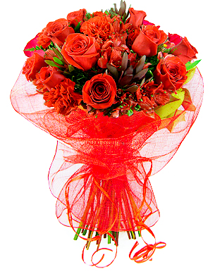 Belíssimo bouquet em tons de vermelho, confeccionado com alstroemérias e rosas importadas, folhagens exóticas e embalado em fina tela importada.