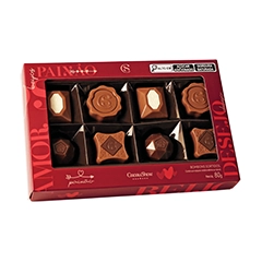 Bombons recheados com doce de leite e baunilha, envoltos em chocolate de alta qualidade, ideais para qualquer ocasião especial.
